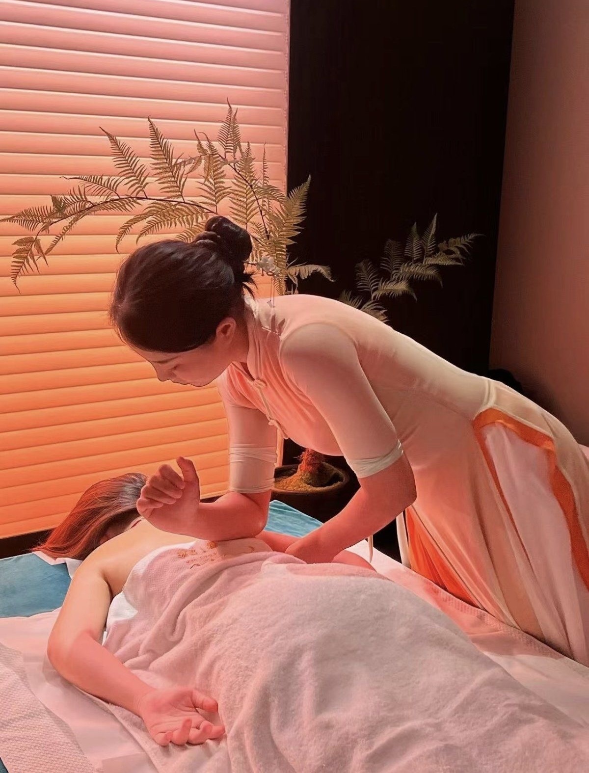 Therapist providing a therapeutic elbow massage