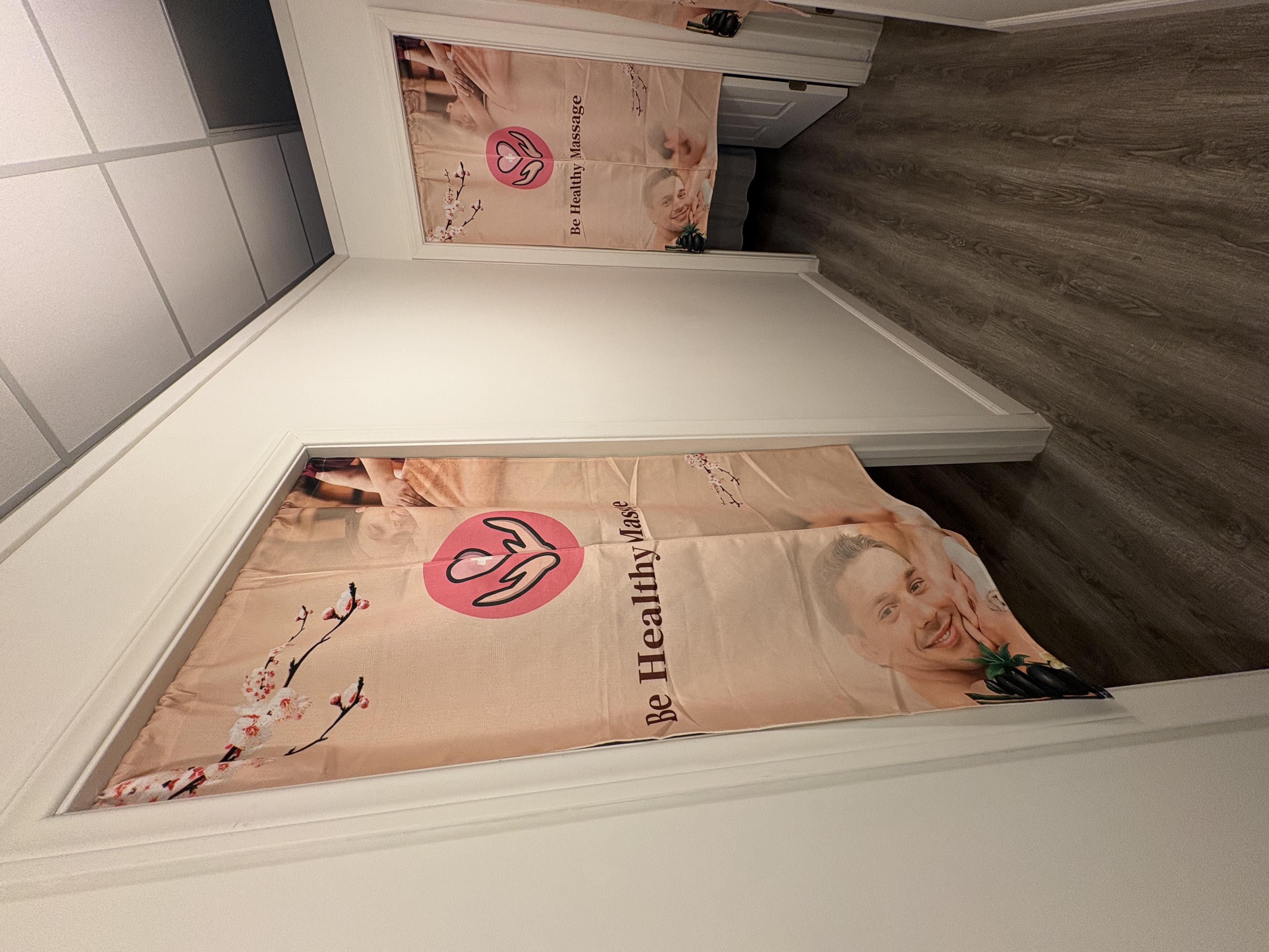Hallway leading to Be Healthy Massage treatment rooms